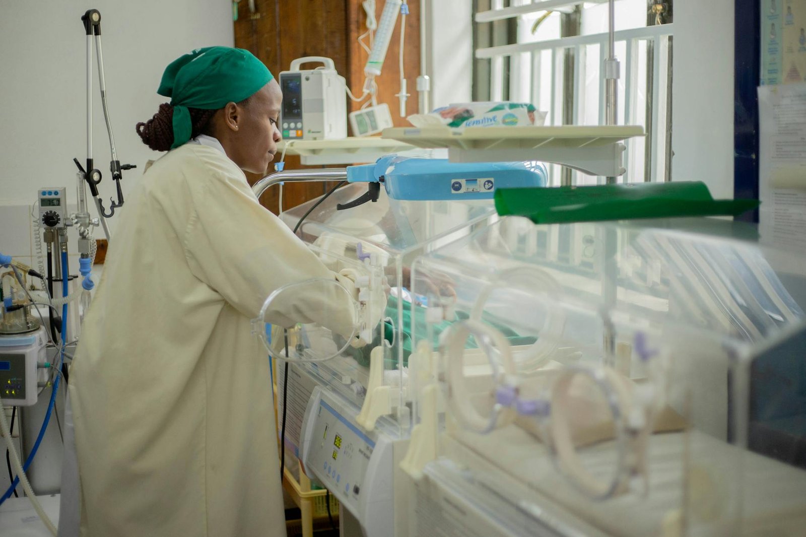 Medical team attending to a newborn in hospital